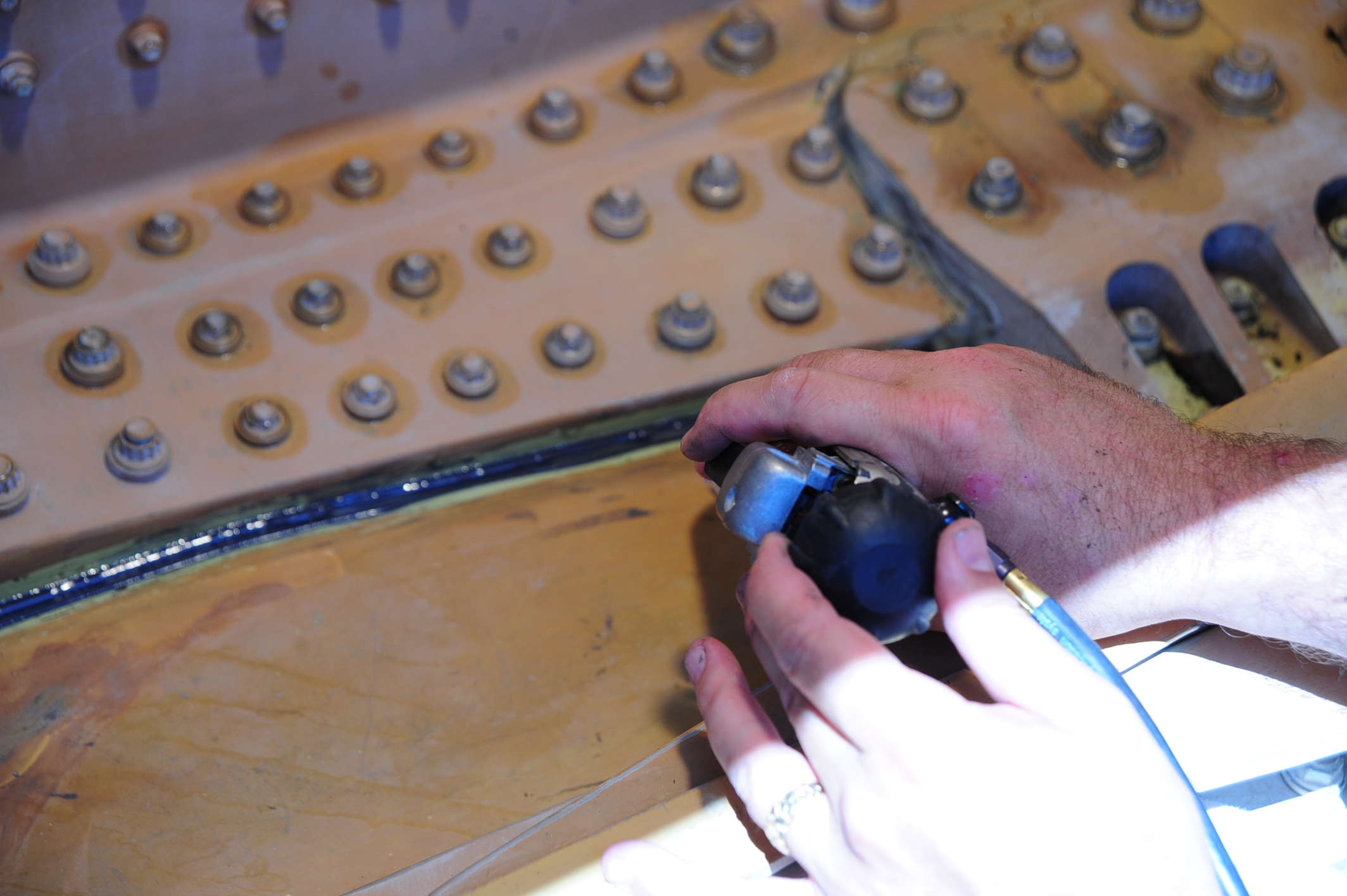 FAA-certified technician performing a high pressure test.